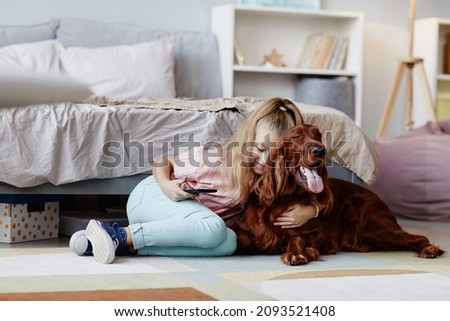 Similar – Image, Stock Photo Little blonde girl playing and holding her young parents hand.