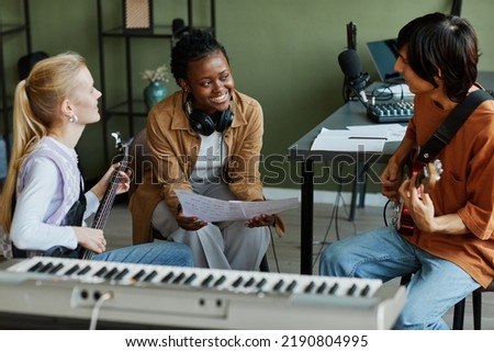 Similar – Image, Stock Photo Musician writing in a notebook