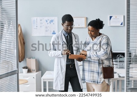 Similar – Image, Stock Photo doctor man indoors, using mobile phone. Wearing protective gloves, mask and stethoscope. coronavirus covid-19 concept