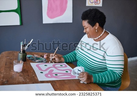 Similar – Image, Stock Photo Senior craftswoman in art studio