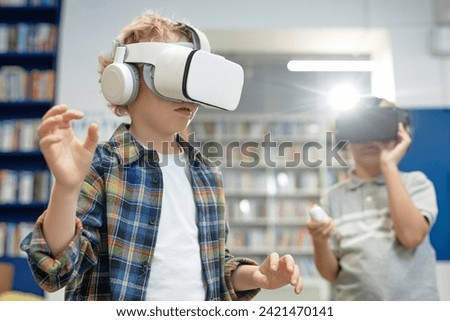 Similar – Image, Stock Photo Child in VR headset playing on couch