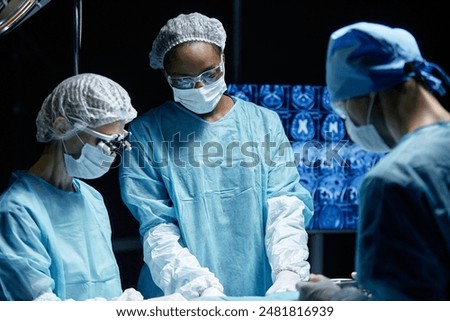 Similar – Image, Stock Photo Woman performing surgery in hospital