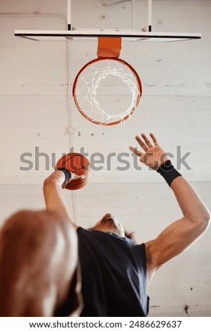 Similar – Image, Stock Photo Young man playing basketball on outdoor court.