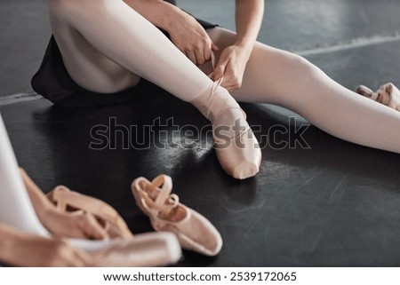 Similar – Image, Stock Photo A teenage girl ties her shoelaces in sneakers, prepares for training