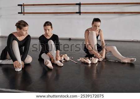 Similar – Image, Stock Photo A teenage girl ties her shoelaces in sneakers, prepares for training