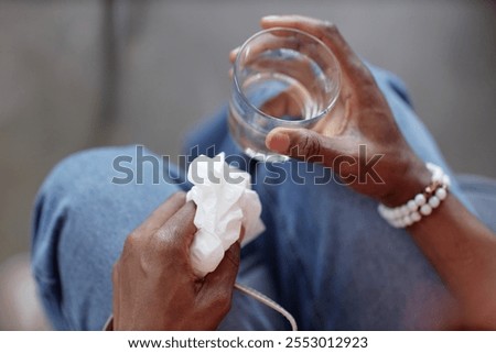 Similar – Image, Stock Photo Unrecognizable person holding medical mask in hand on street in evening