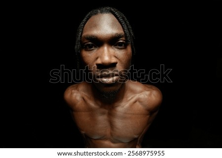 Image, Stock Photo Serious shirtless African American man with fists in studio