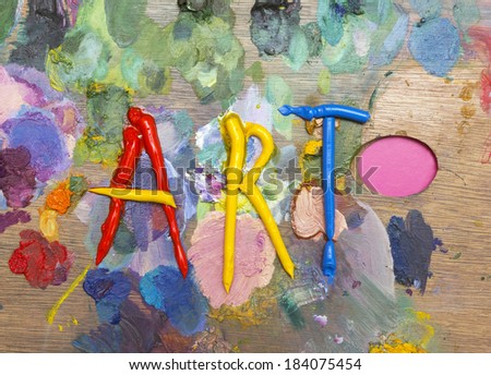art palette of paints and brushes