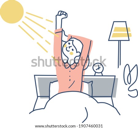 A woman stretching in bed while bathing in the morning sun