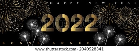 2022- New Year’s night party mood banner with fireworks and sparklers - French, English text, translation: Happy New Year. 