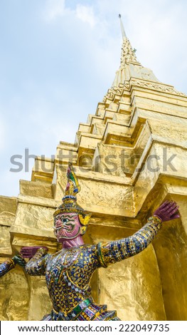 The demon statue supporting golden pagoda at Temple of emerald