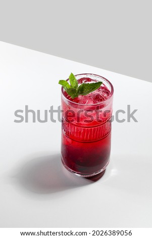 Similar – Image, Stock Photo Red alcohol cocktail with black olive and whiskey lemon cocktail