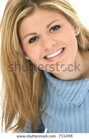 Very happy teen girl close-up. Shot in studio over white.