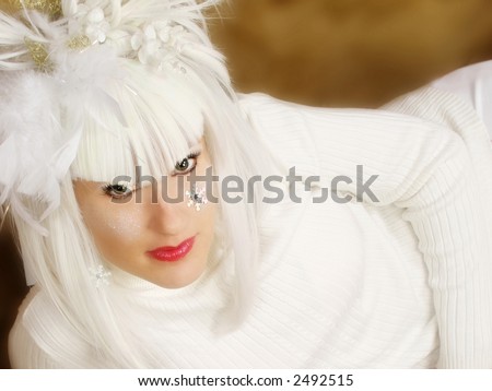 Beautiful woman with white winter hair and face art.