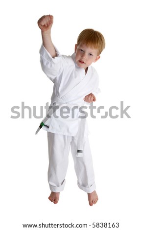 boy in gi making karate moves over white with clipping path