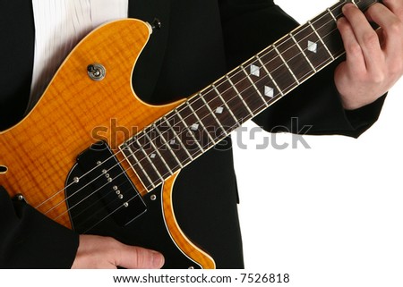 Young man\'s hands on electric guitar.