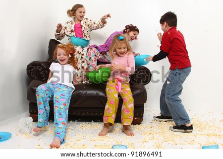 Food fight with brother at girl's pajama party sleep over with popcorn mess.