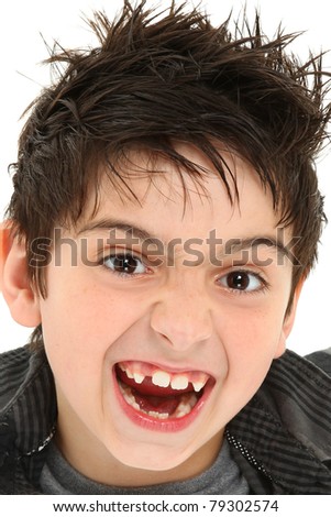 Hilarious 8 year old boy making crazy face up close. Stock fotó © 