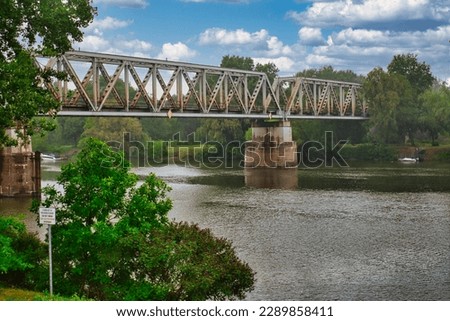 Similar – Image, Stock Photo Old bridge over river against town in mountainous area