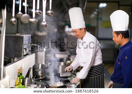 Similar – Image, Stock Photo Kitchen staff in Asian cafe