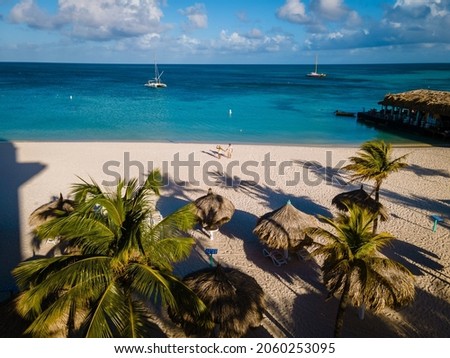 Palm Beach Aruba Caribbean, white long sandy beach with palm trees at Aruba Antilles Foto d'archivio © 