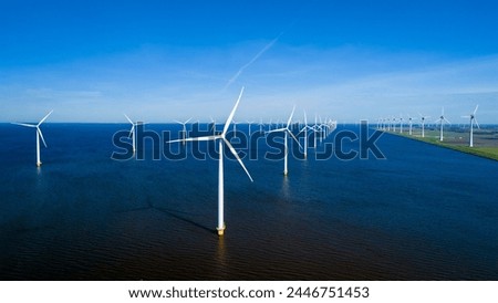 Similar – Image, Stock Photo Rotating windmill generating renewable energy wind power at land