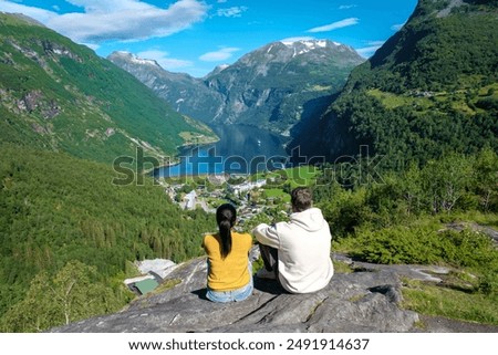 Similar – Image, Stock Photo A fjord in Norway. In the foreground the sea and in the background snow-covered mountain tops. The blue sky is decorated by veil clouds.