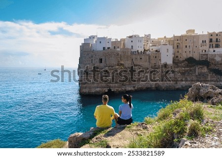 Similar – Image, Stock Photo Traveling couple admiring breathtaking landscape of bay in summer