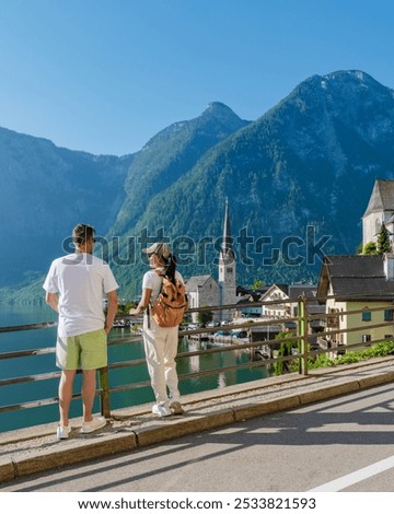 Similar – Image, Stock Photo Traveling couple admiring breathtaking landscape of bay in summer
