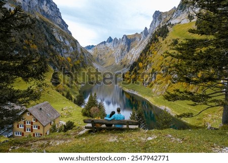 Similar – Image, Stock Photo Traveling couple admiring breathtaking landscape of bay in summer