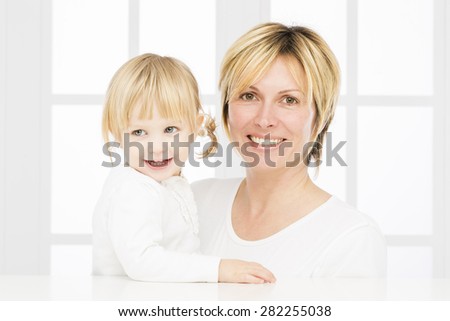 Forty years old mother with her two years old baby girl