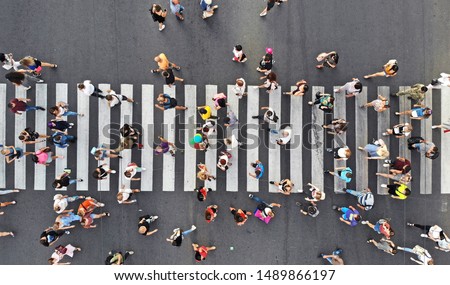 Similar – Foto Bild auf dem Zebrastreifen auf der Straße gehen.