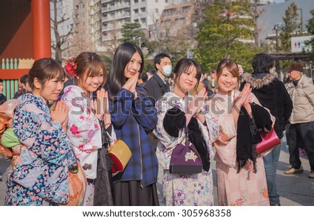 Tokyo, Asakusa. January 25, 2015. girls in japanese typical dress. The kimono is the traditional japanese dress and means literally \
