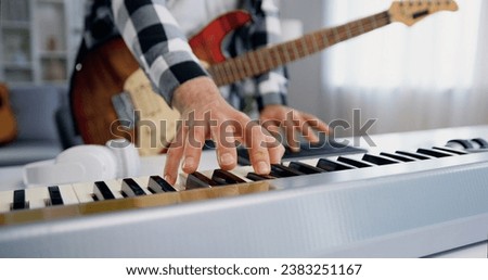 Similar – Image, Stock Photo Hands playing a midi keyboard in a music studio