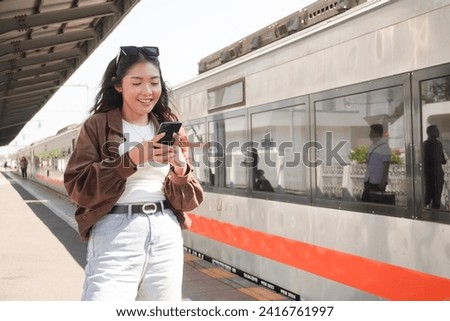 Similar – Image, Stock Photo teenager looks at her mobile phone