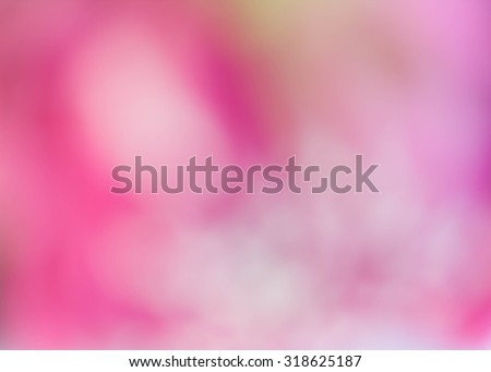 Pink lotus surface near a blur.