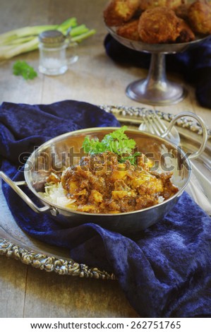 fish curry with rice served in tradition indian bowl. selective focus