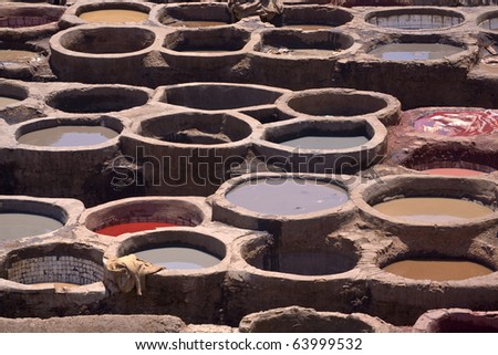 Morocco. Fez (Fes el-Bali). The tanner\'s quarter - close up of tubs (bend) with dyes in them
