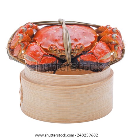 Hairy crabs on the Bamboo steamer Isolated in white background