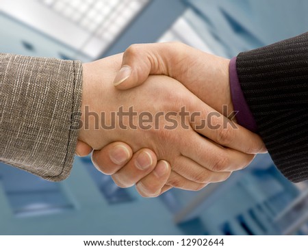 Man and woman business handshake