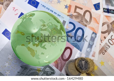 Glass world and Euro currency depicting global finance