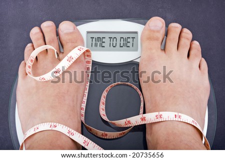 Dieting concept, bathroom scales saying time to diet