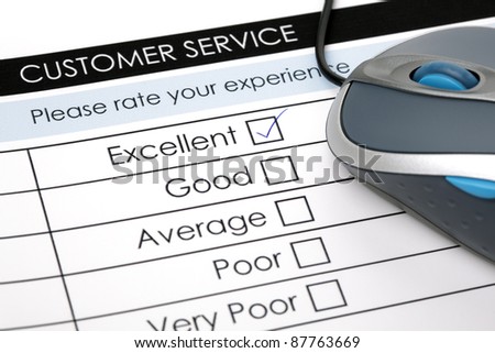 Tick placed in excellent check box on customer service satisfaction survey form with computer mouse