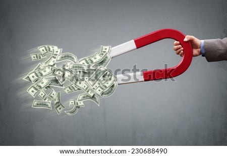Businessman attracting money with a horseshoe magnet concept for business success, strategy or greed
