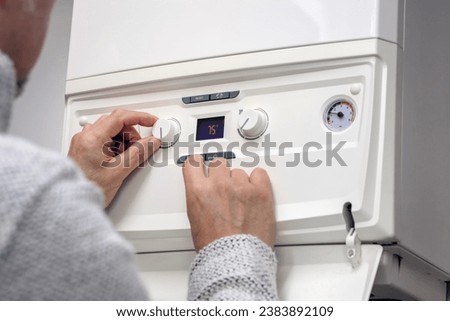 Similar – Image, Stock Photo Water heater or boiler repair, with electrical wires and pipes in the bathroom. close-up.