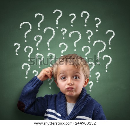 Child scratching head with question mark on blackboard concept for confusion, brainstorming and choice