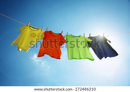 Similar – Image, Stock Photo Red garments hang to dry on the clothes drying rack