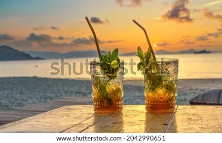 drinks with blur beach and sunset in background Zdjęcia stock © 
