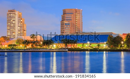 Night cityscape, Meeting hall in Thailand at dusk. View from public park.