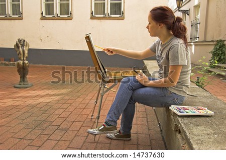 The young artist in the street of Riga.